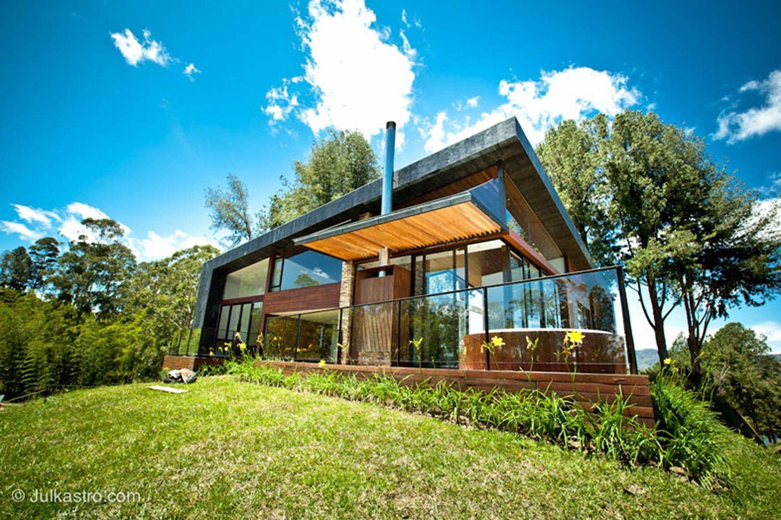 Exterior Hotel Luxe con piscina y jardines - proyecto hotelero de lujo diseñado por Vicaría Arquitectura con arquitectura moderna y paisajismo
